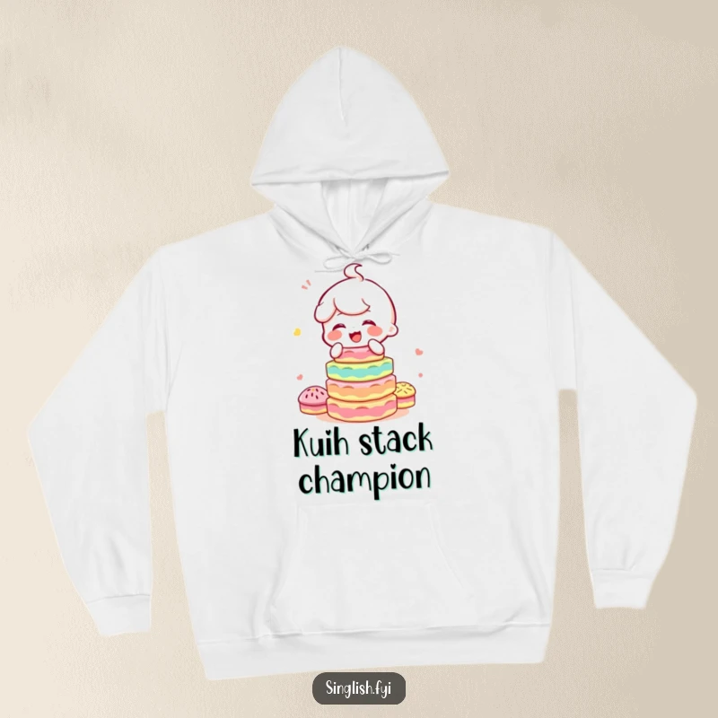 Funny hoodie with a happy character giggling while balancing a colorful, precarious stack of kuih, perfect for cozying up with treats.