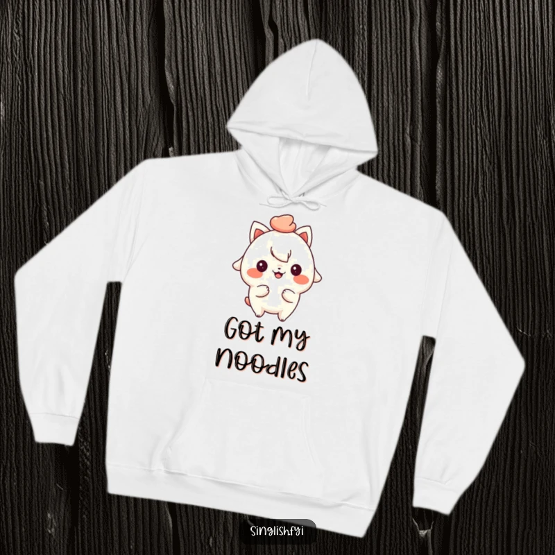 Funny hoodie depicting a playful character with a cheeky grin, holding up a delicious bowl of mee pok noodles.