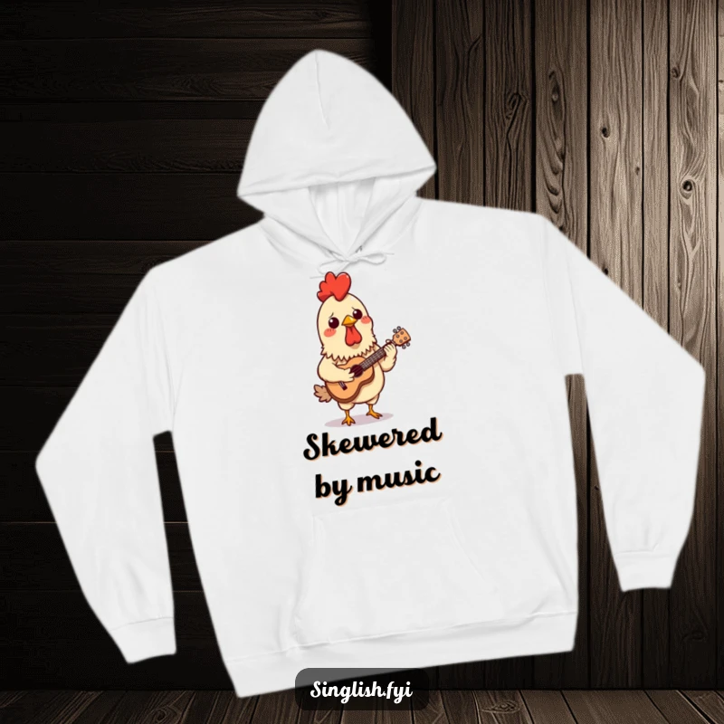 Funny hoodie depicting a confused chicken satay skewer hilariously attempting to play a miniature ukulele, perfect for cozy, humorous style.